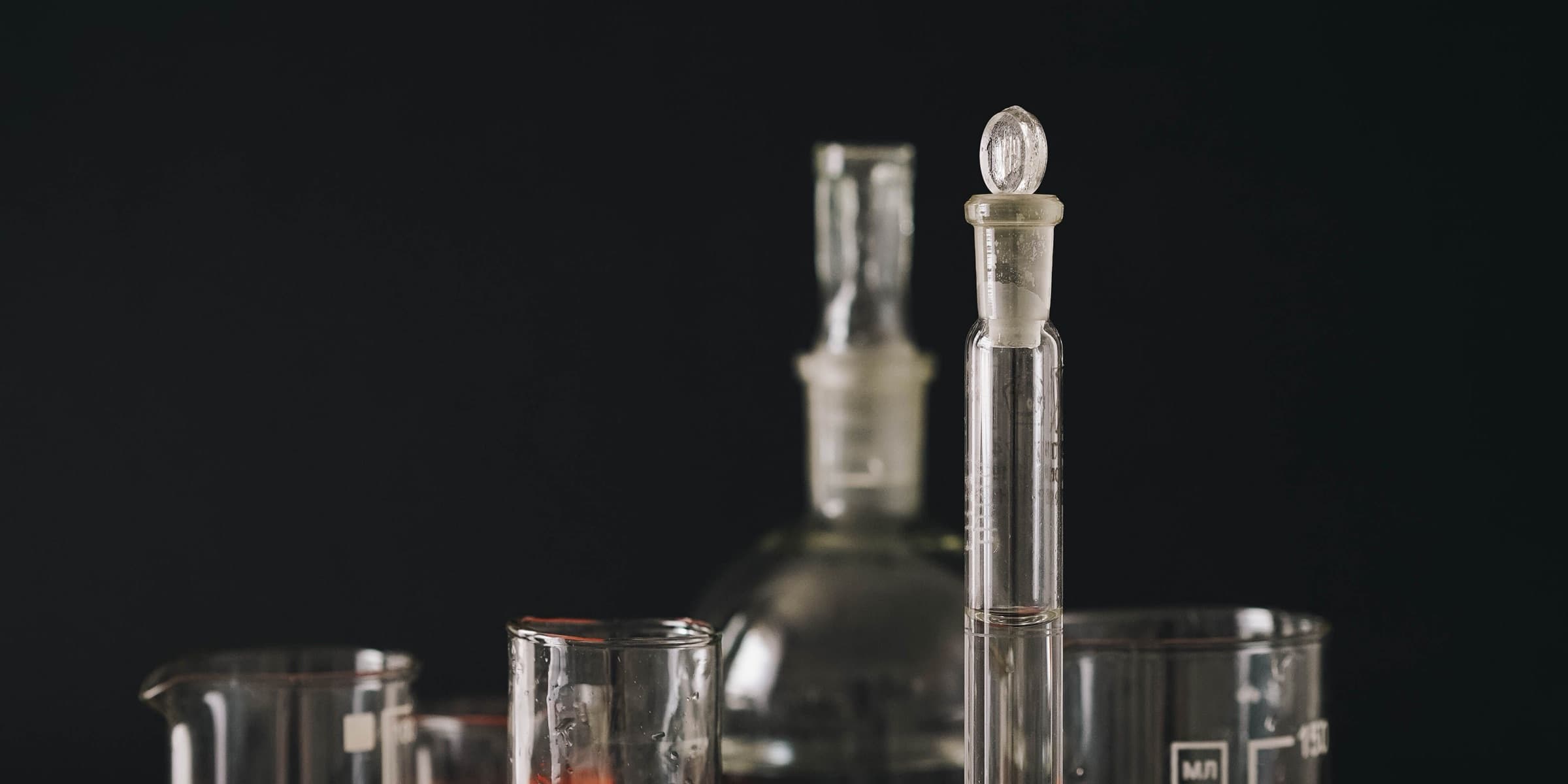 Laboratory glassware on a black background