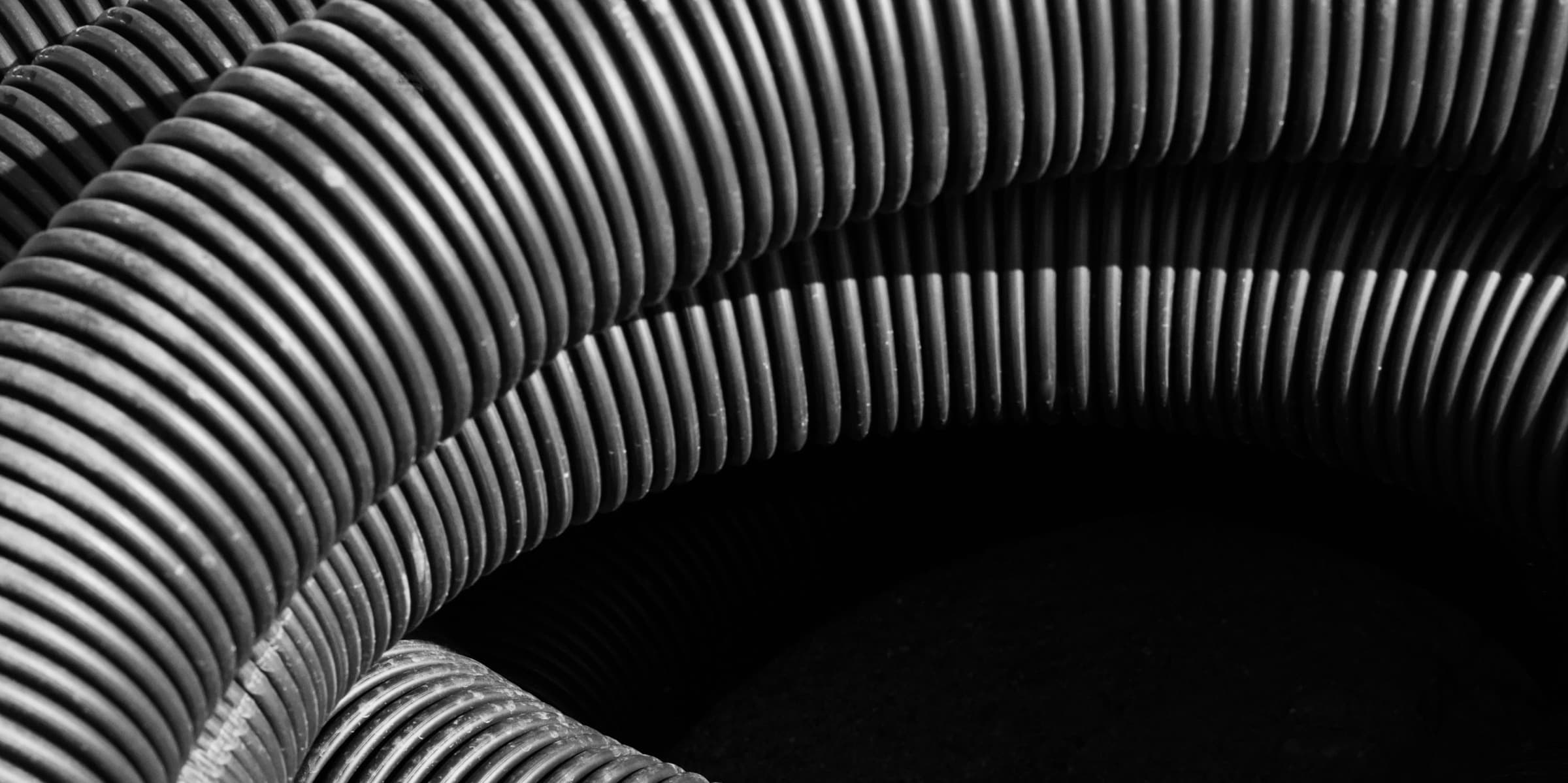 Coiled industrial corrugated tubes